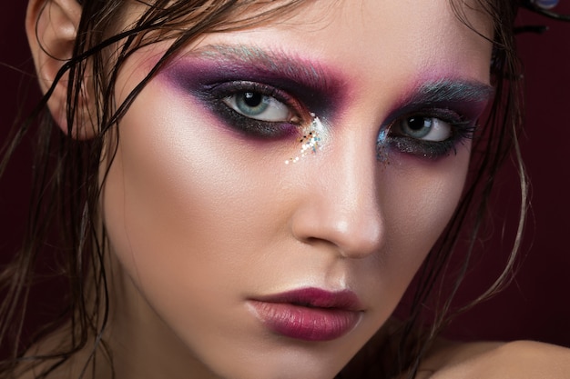 Photo portrait of a young girl with make up