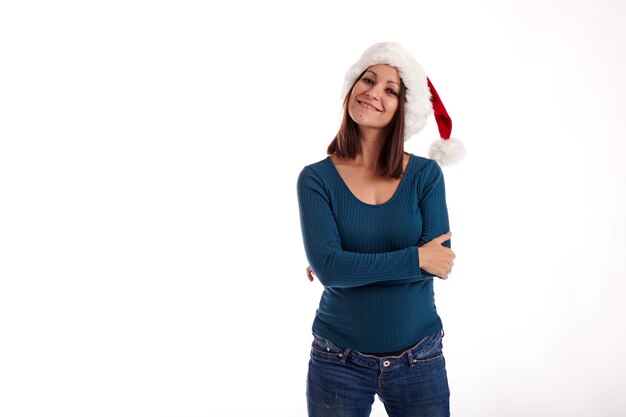 Portrait of a young girl with a Santa Claus hat on a white background