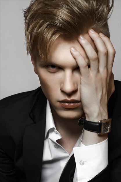 Portrait of young glamour handsome man in suit