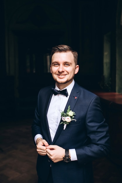 Portrait of a young groom posing