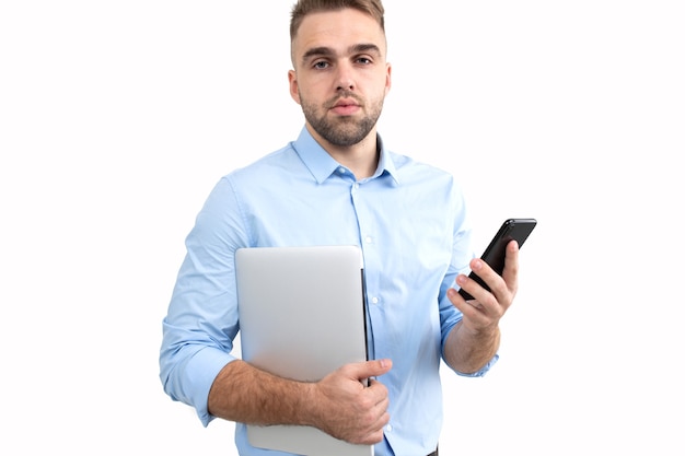 Portrait of a young guy in a business style who is talking on the phone