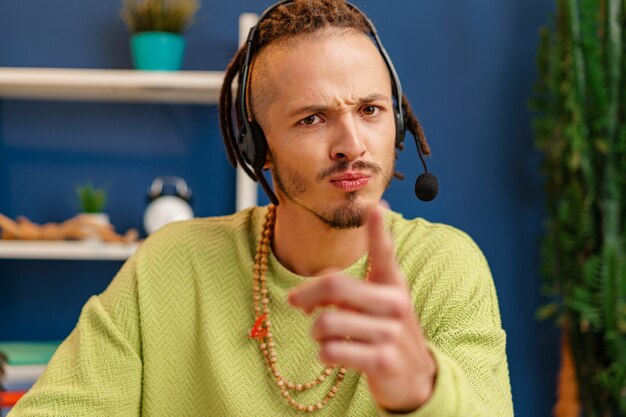 Portrait of a young guy with headset, customer service worker concept