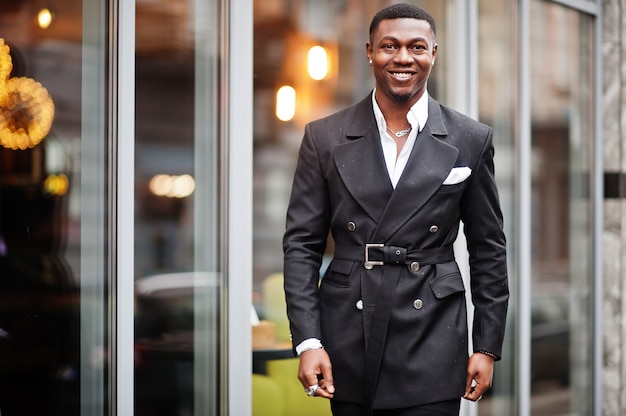 Portrait of young and handsome african american businessman in suit.