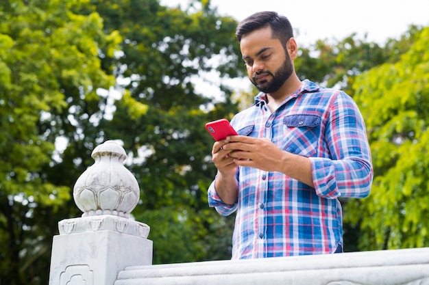 Portrait Of Young Handsome Bearded Indian Man In Lumpini Park