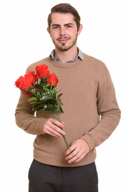 Portrait of young handsome bearded man ready for Valentine's day