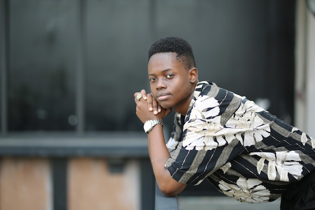 Portrait of young handsome  black man posing outdoor.