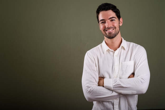 Portrait of young handsome businessman with stubble beard