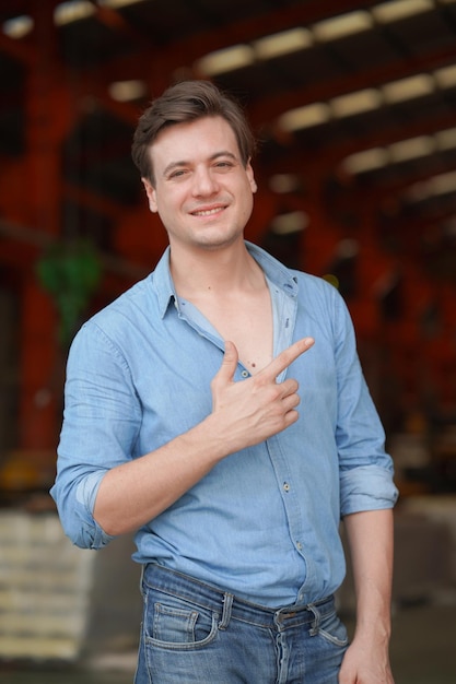 Portrait of a young handsome confident on casual outfit standing outdoor