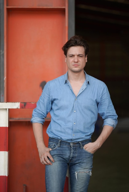 Portrait of a young handsome confident on casual outfit standing outdoor