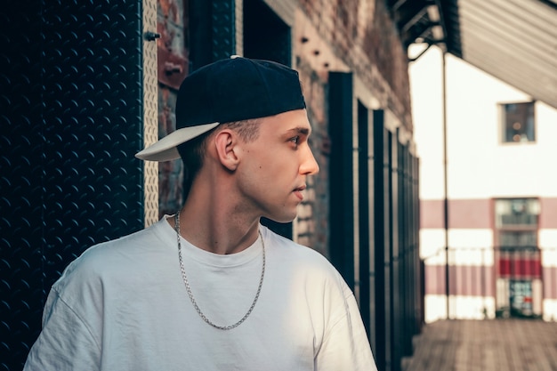 Portrait of a young handsome man in a cap