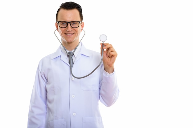 Portrait of young handsome man doctor with eyeglasses using stethoscope