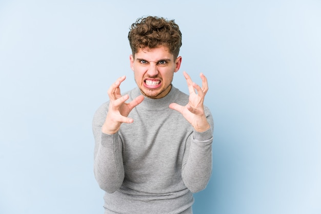 Portrait of a young handsome man screaming