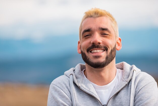 portrait of young handsome man smiling outdoor