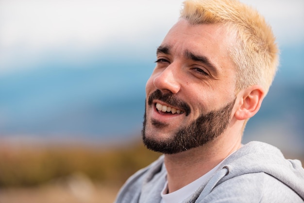 portrait of young handsome man smiling outdoor