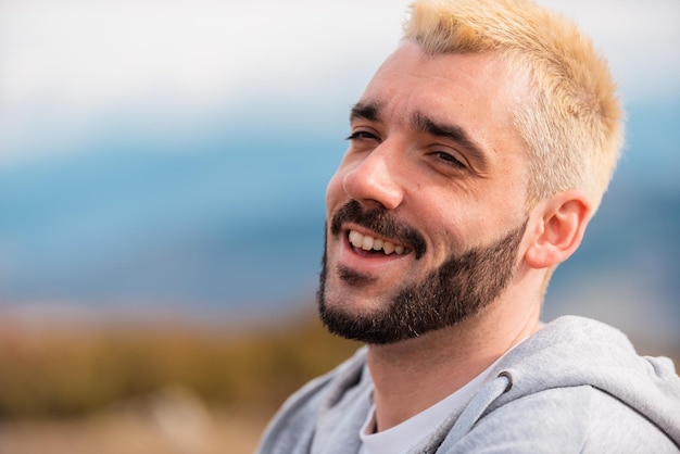 Portrait Of Young Handsome Man Smiling Outdoor