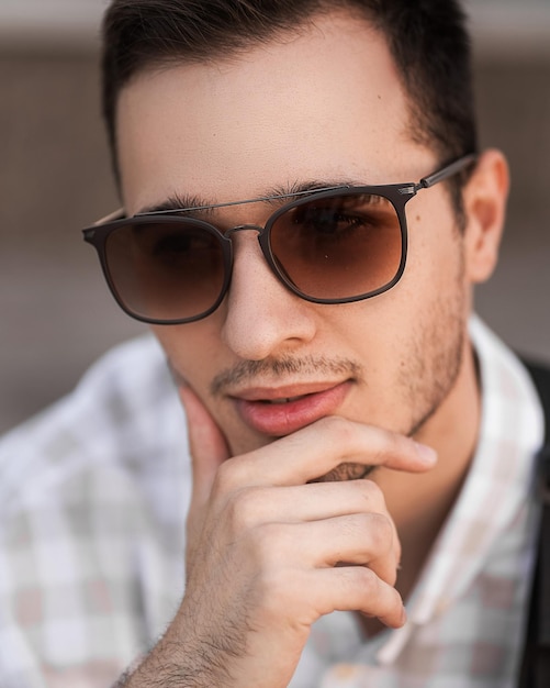 Portrait of a young handsome man in sunglasses