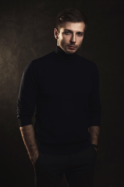 Portrait of young handsome man wearing a polo neck