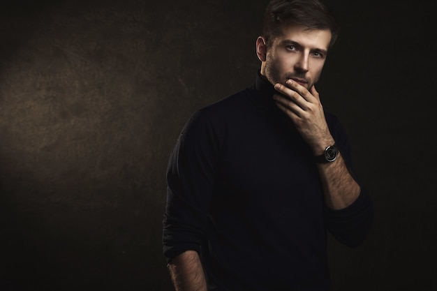 Portrait of young handsome man wearing a polo neck