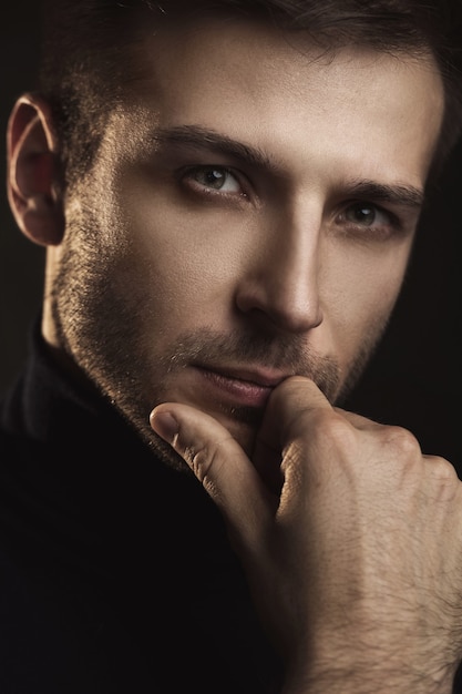 Portrait of young handsome man wearing a polo neck