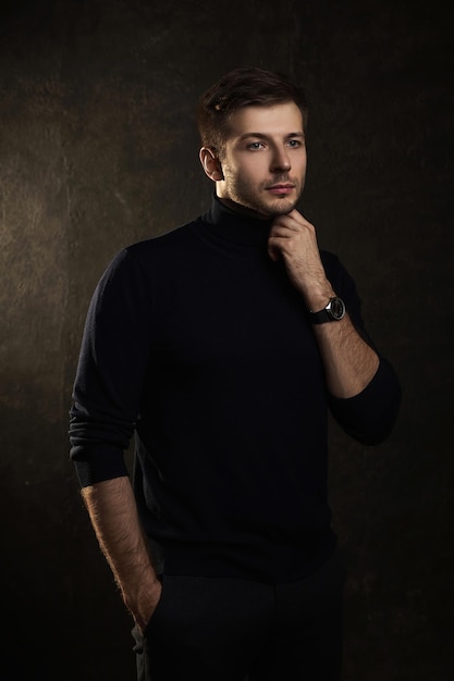 Portrait of young handsome man wearing a polo neck