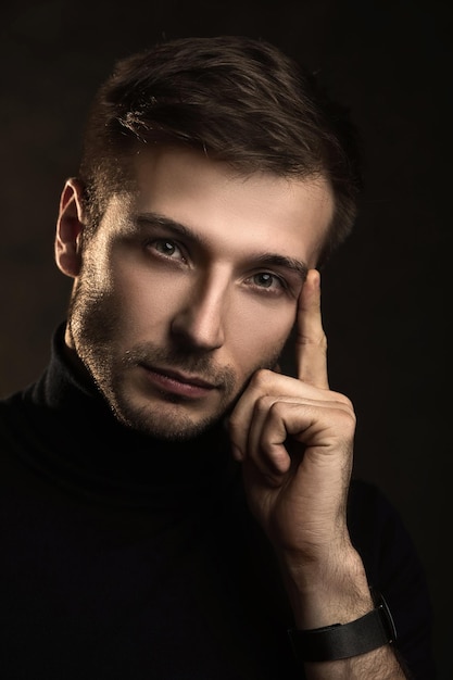 Portrait of young handsome man wearing a polo neck