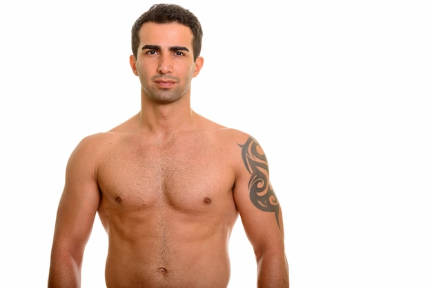 Portrait of young handsome Persian man shirtless