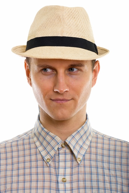 Portrait of young handsome tourist man wearing hat