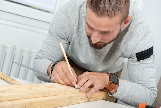 Portrait of young handyman working at home