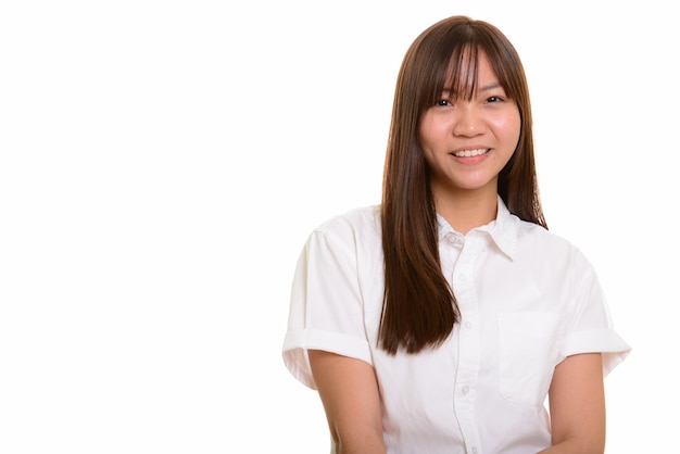 Portrait of young happy Asian teenage girl smiling