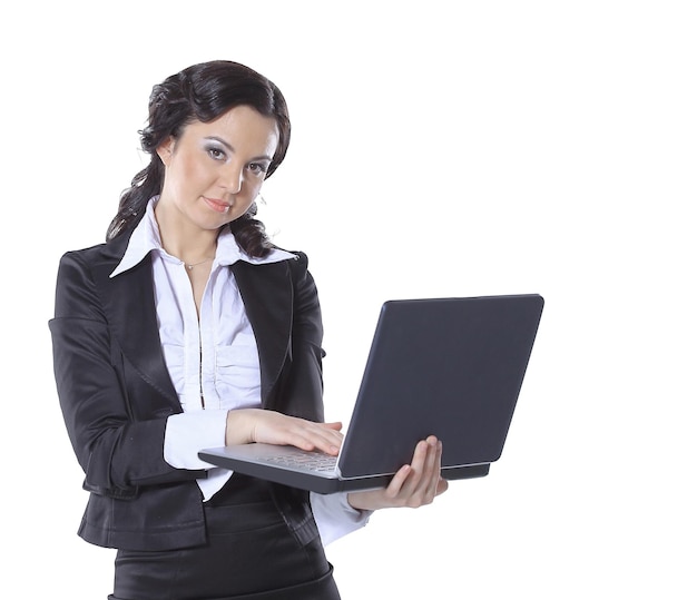 Portrait of a young happy business woman with a laptop over white background