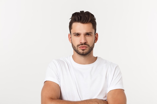 Portrait of the young happy smiling handsome man isolated on a white