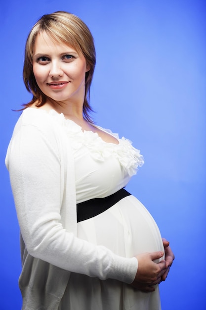 Portrait of the young happy smiling pregnant woman