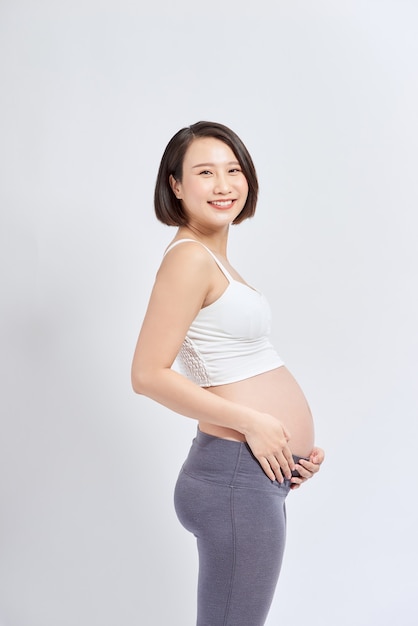 Portrait of the young happy smiling pregnant woman