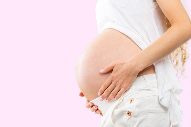 Portrait of the young happy smiling pregnant woman