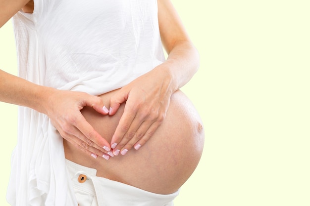 Portrait of the young happy smiling pregnant woman