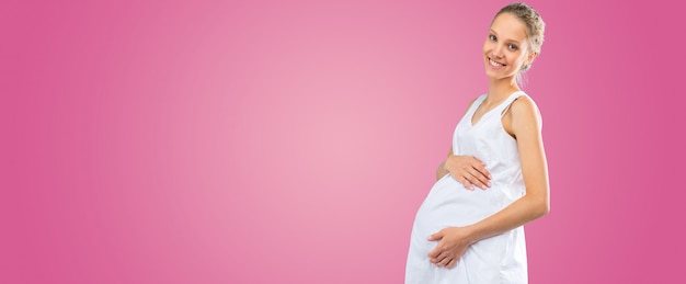 Portrait of the young happy smiling pregnant woman