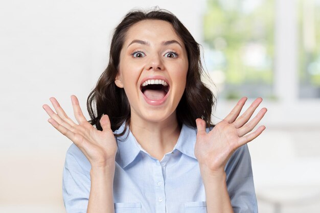 Portrait of a young happy smiling woman