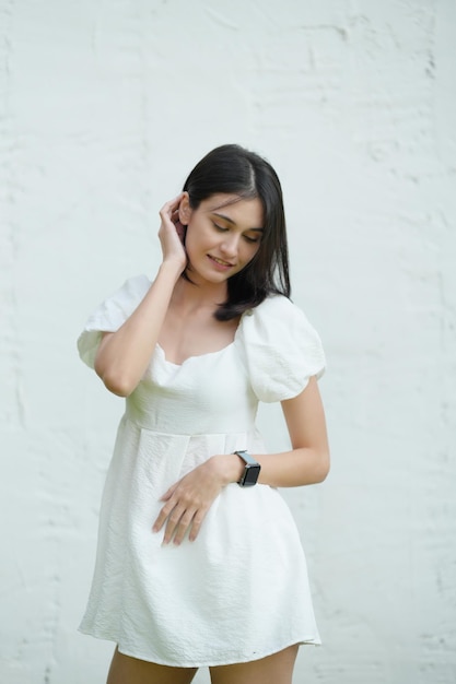 Portrait of young happy woman looks in camera