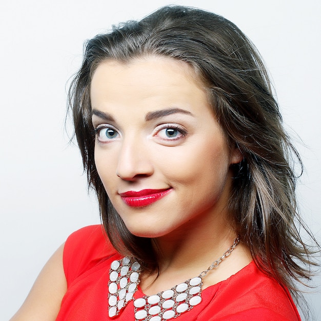 Portrait young happy woman in red dress