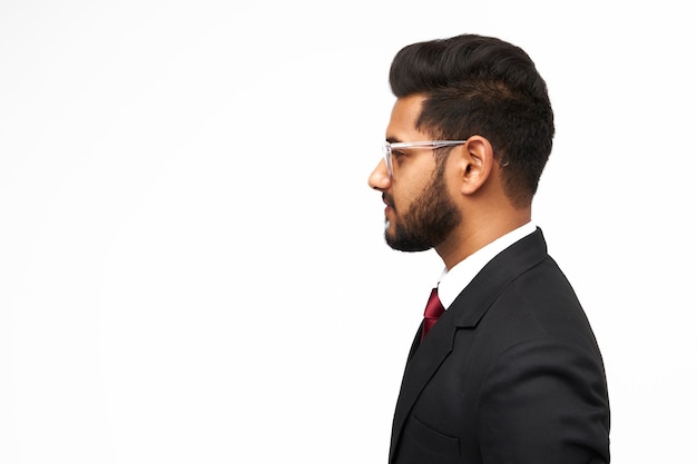 Photo portrait of young indian business man on white isolated background.