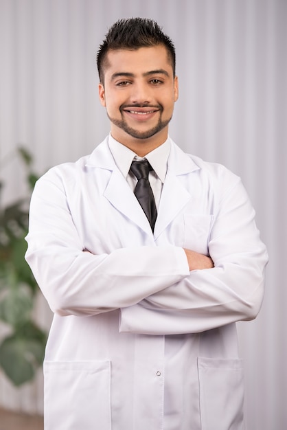 Portrait of a young Indian doctor in clinic.