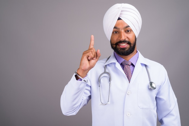 Portrait of young Indian Sikh man doctor