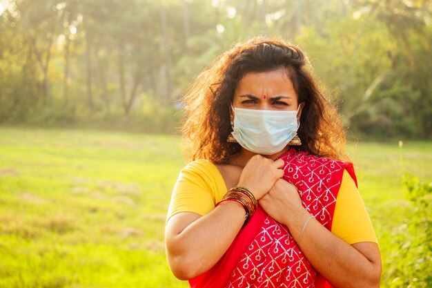 Portrait of a young indian woman wearing mask the concept of tourism health and safety in the Asian and India countries