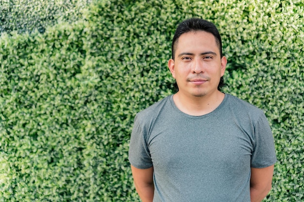 Portrait of a young indigenous man dressed in casual clothes.