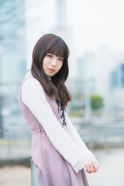 Portrait of young japanese woman outdoors in cloudy day