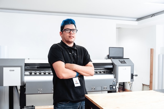 Portrait of a young latin american worker man.