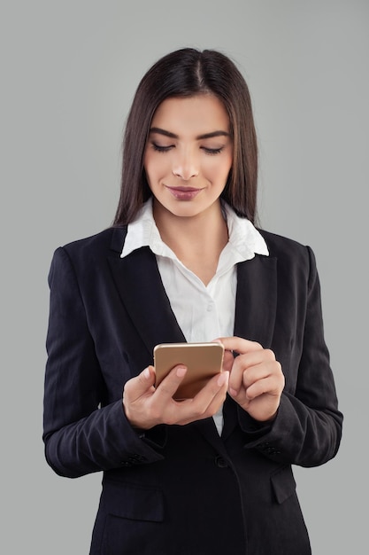 Portrait of young latin woman adhesive notes using mobile phone Hispanic Business Woman in Suit