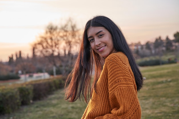 Portrait of young latin woman looking at the camera Young Venezuelan woman with long hair