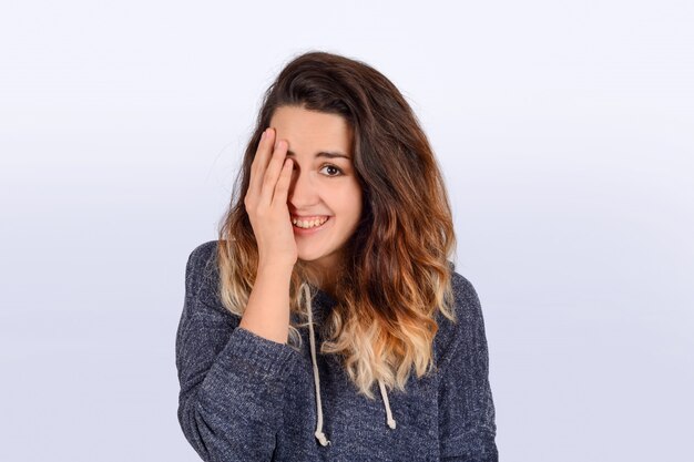 Portrait of young latin woman in a studio.