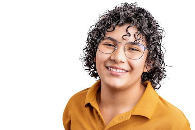 Portrait of a young Latino teenager with curly hair and glasses looking at the camera